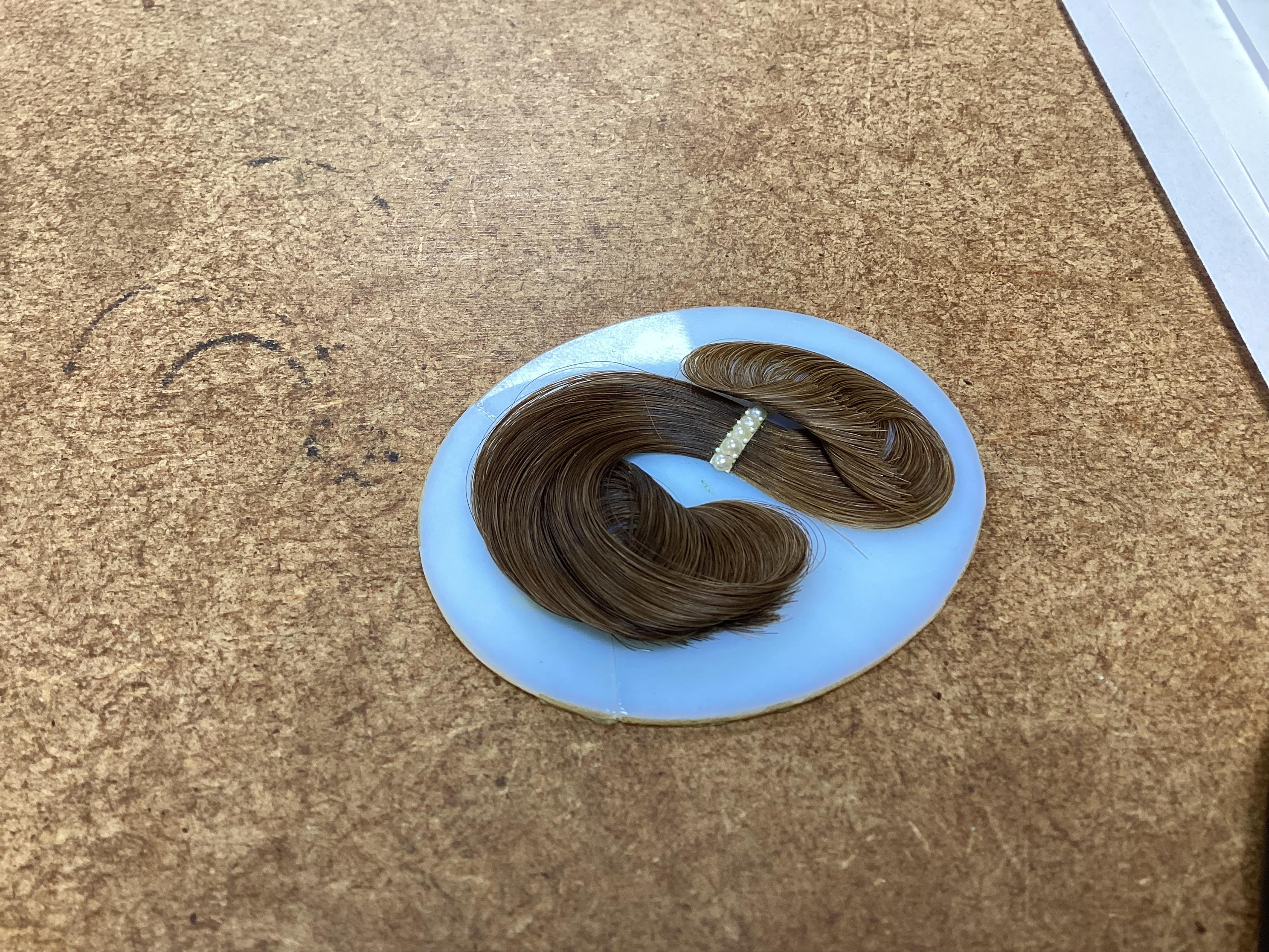 Regency School, Portrait miniature of a young gentleman, oval watercolour on ivory, housed in a yellow metal pendant frame with hairwork panel verso, glass loose, overall 7cm high - IVORY SUBMISSION BKCK66FM